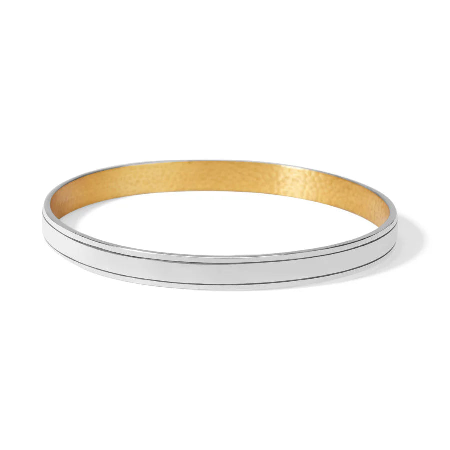 Gold and silver bangle on a white background