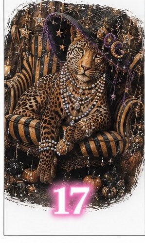 Bling tee design #17 — leopard in a starry witch hat and pearls on a striped armchair