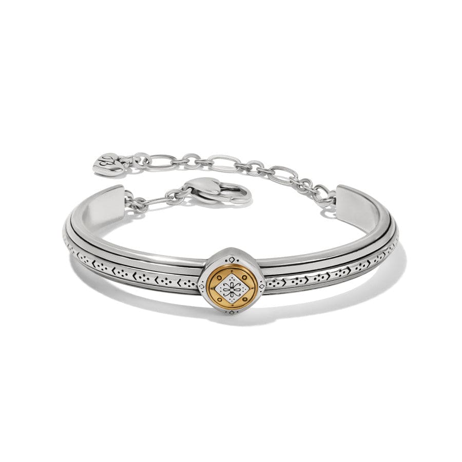 Silver bracelet with a gold emblem on a white background