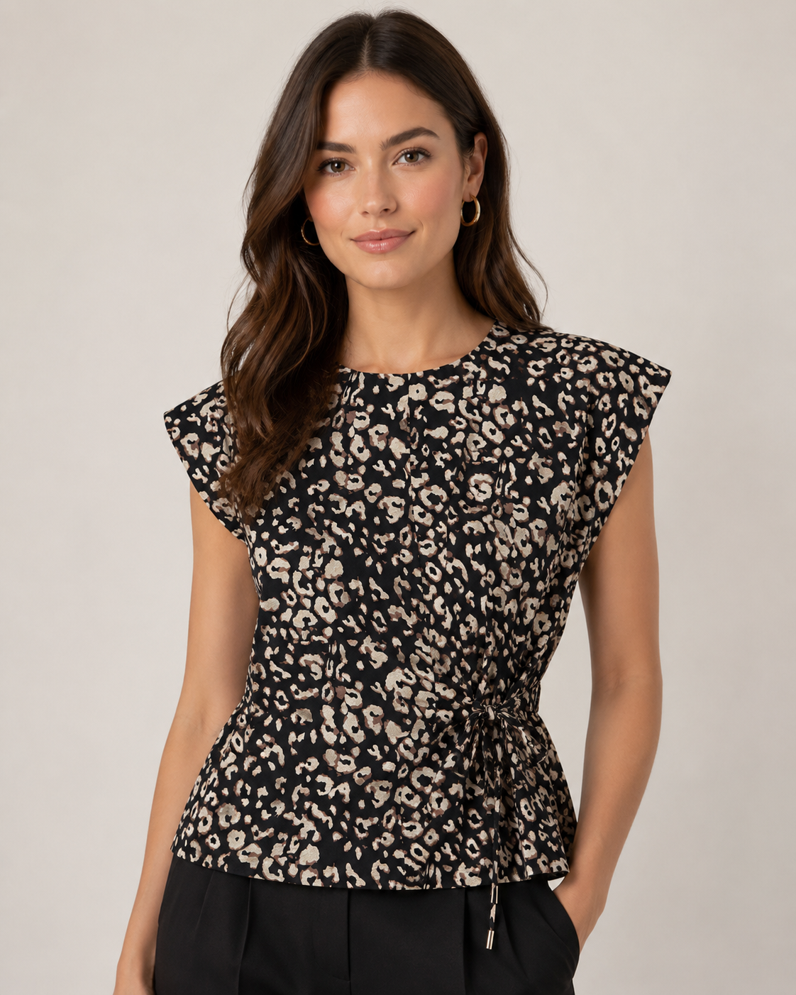Animal print top with an adjustable side tie at the waist