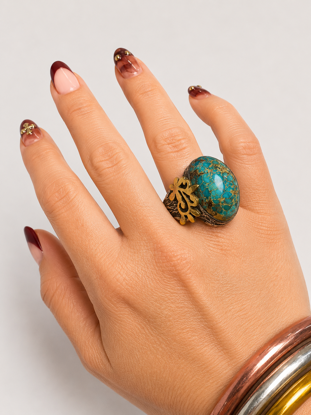 Bora turquoise dome ring, a rounded turquoise stone raised on a substantial band