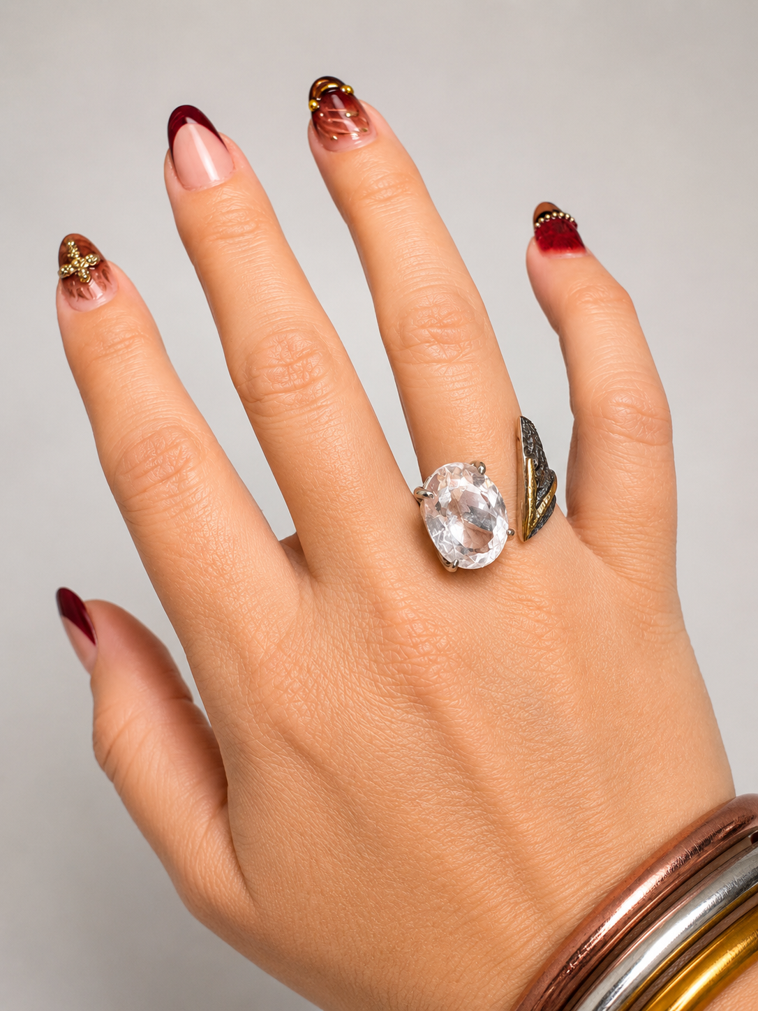 Oxidized silver and gold crystal wrap ring with a sparkling crystal accent