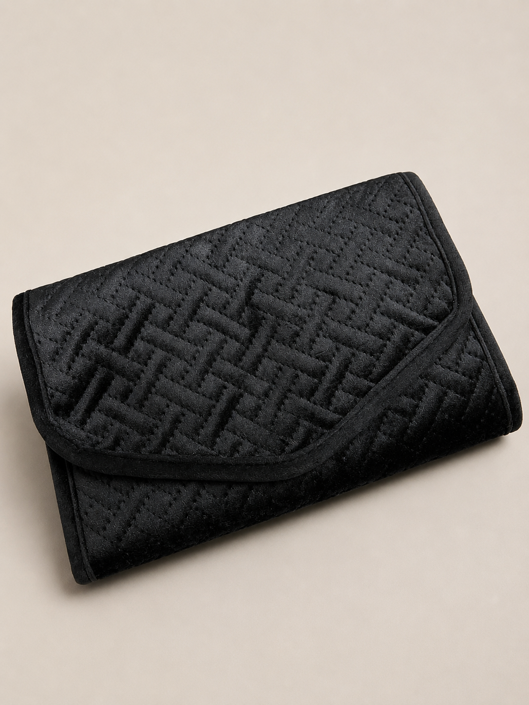 Black quilted jewelry clutch with multiple compartments