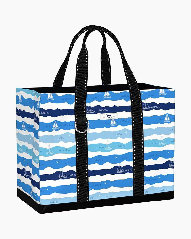 Tote bag with blue and white wave pattern and black handles on a white background