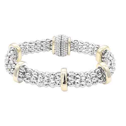 Two tone magnetic bracelet with an interlocking ring design
